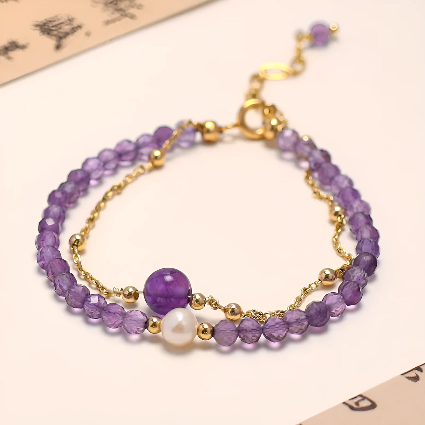 Amethyst colour crystal women's bracelet with diamond cut shapes and Chinese style design