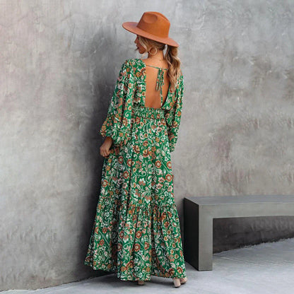 A green halter dress with a vibrant printed pattern and lantern sleeves.