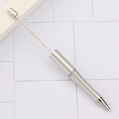 Rotating bead ballpoint pen in gradient colour with ABS plastic and steel wire construction