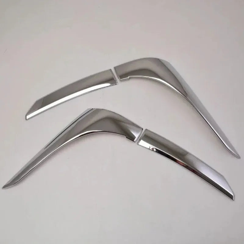 Set of four silver electroplated tail light eyebrow trims for Mitsubishi Outlander on white background.