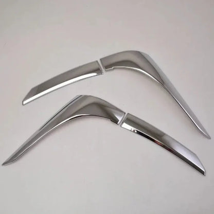 Set of four silver electroplated tail light eyebrow trims for Mitsubishi Outlander on white background.