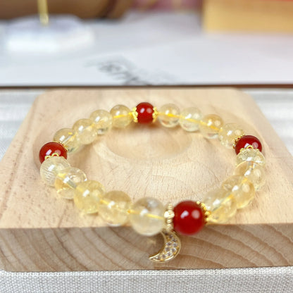 Citrine red agate moon boom crystal bracelet for women on a white background.