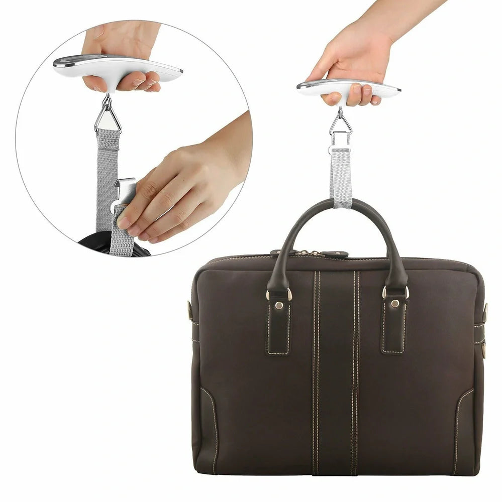 Silver digital luggage scale with LCD display showing weight measurement and integrated hanging belt