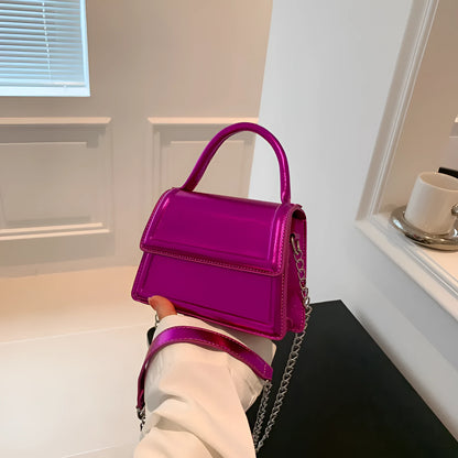 Retro style square PU leather crossbody bag in multiple colours on a model.