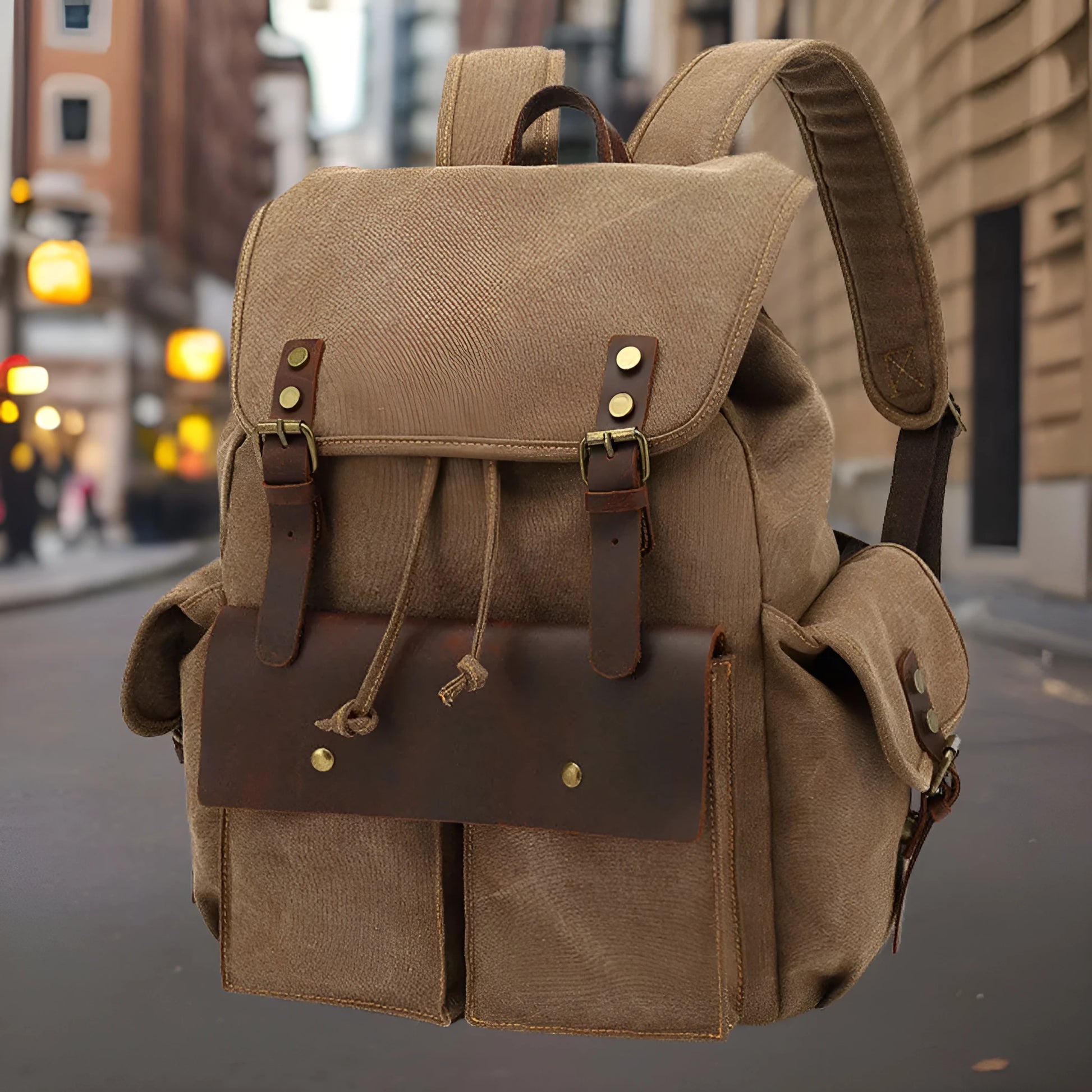 Retro canvas backpack in army green with antique bronze hardware, showing front compartments and size.