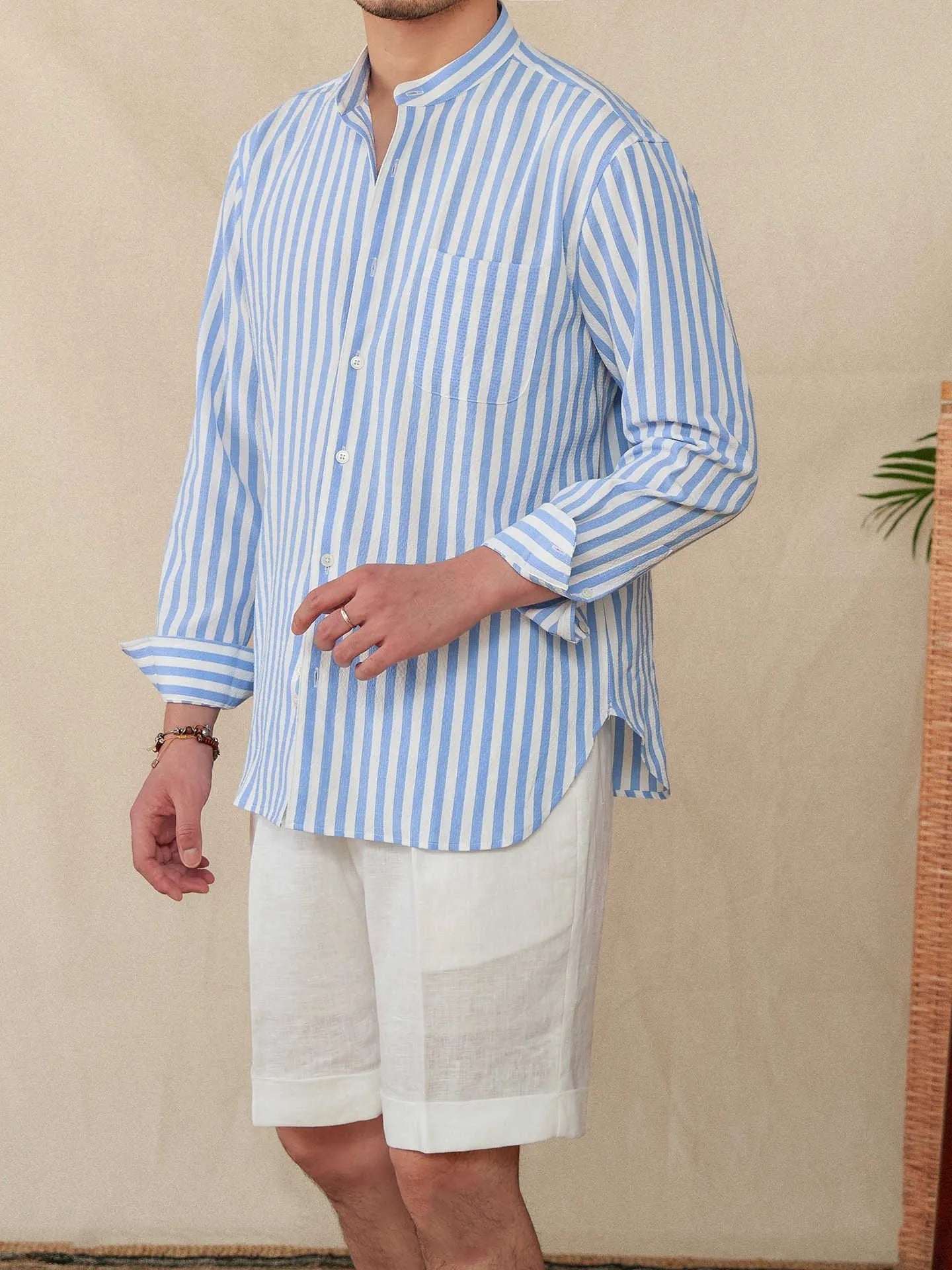 Blue and white seersucker stripe long sleeve shirt with a loose lapel baseball collar