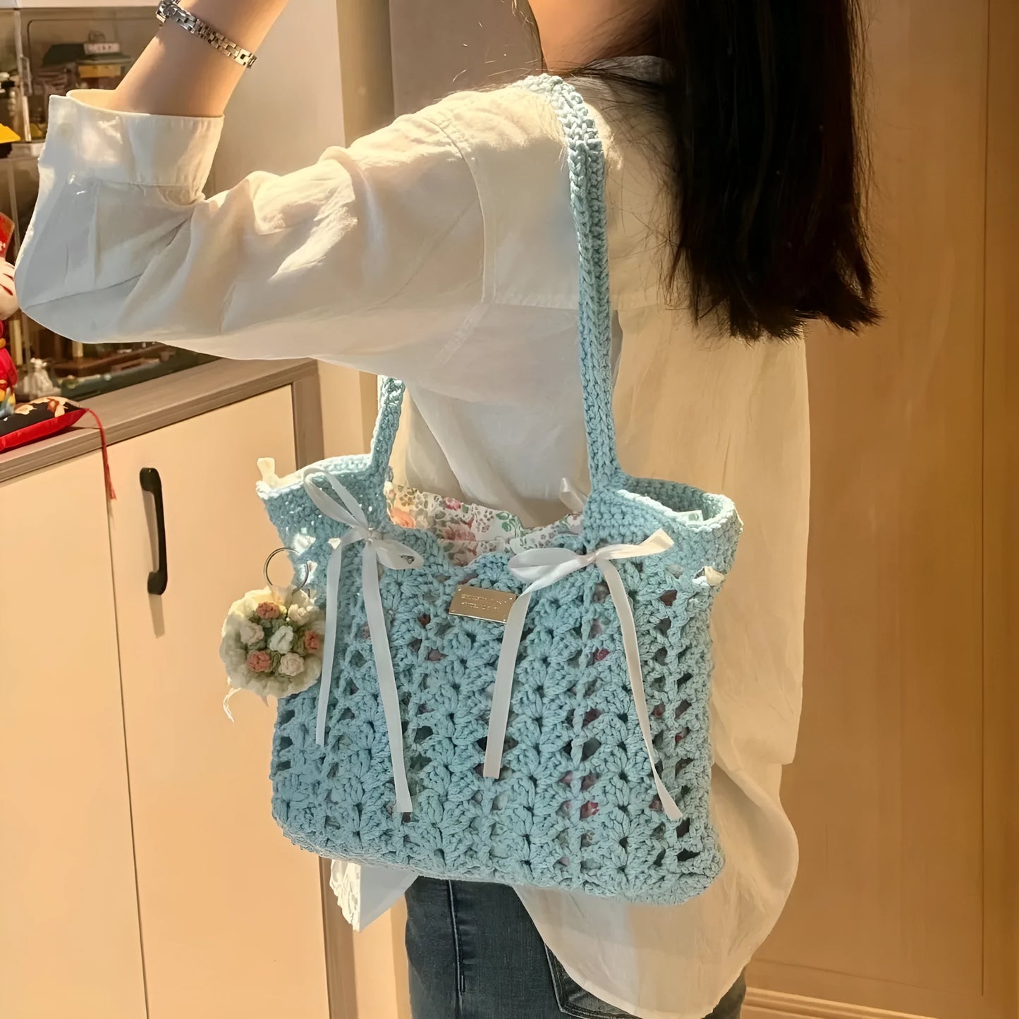Handmade woven wool bag with floral pattern, approximately 0.5m tall