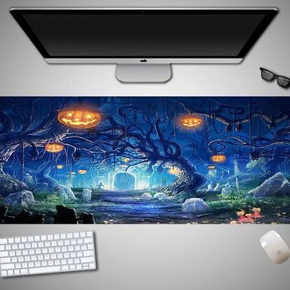 Oversized black Halloween-themed mouse pad with graphic design on a desk with keyboard and mouse