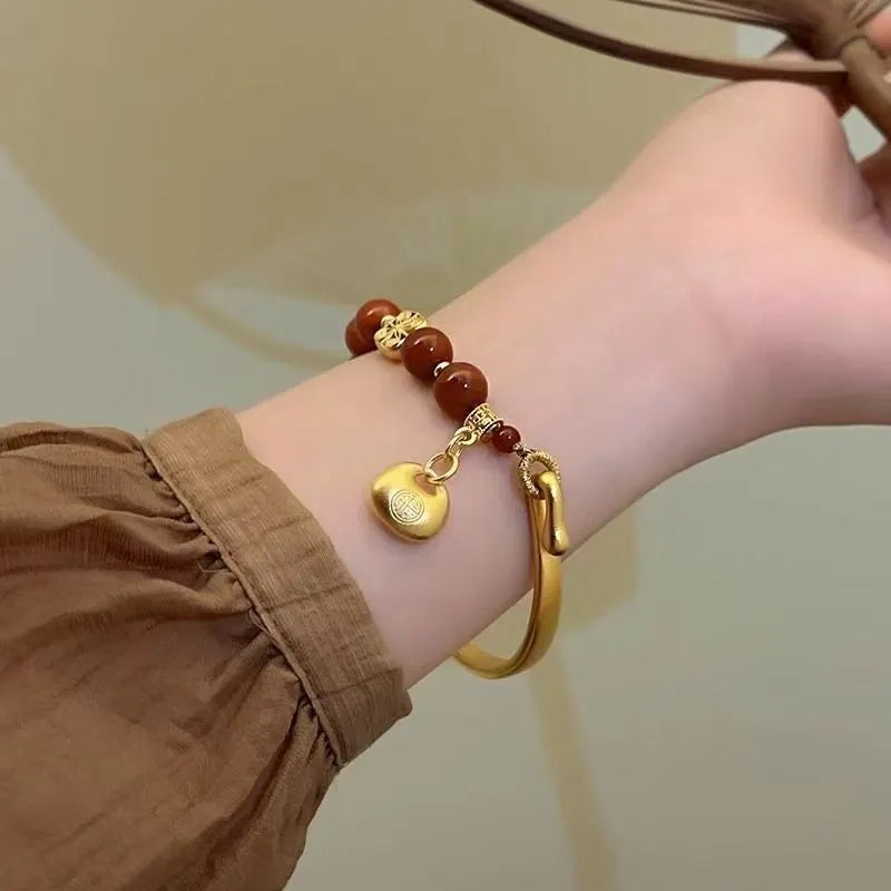Golden antique-style Southern Red Agate Character Ingot half bracelet for women with lucky bag design.