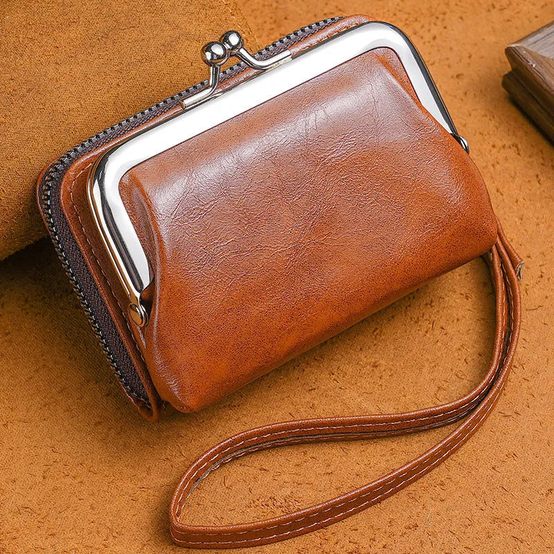 Ladies buckle-fastening coin purse with a 4-inch metal clip and zip, shown in multiple colour options.