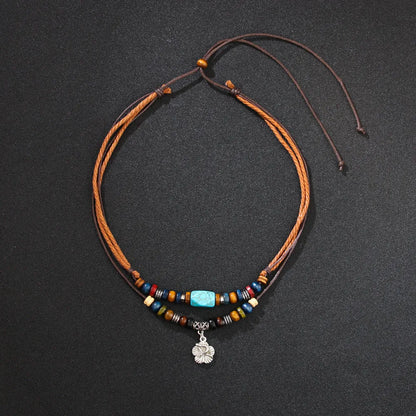 Men's wooden bead necklace with turquoise beads, wax rope cord and alloy geometric flower pendant