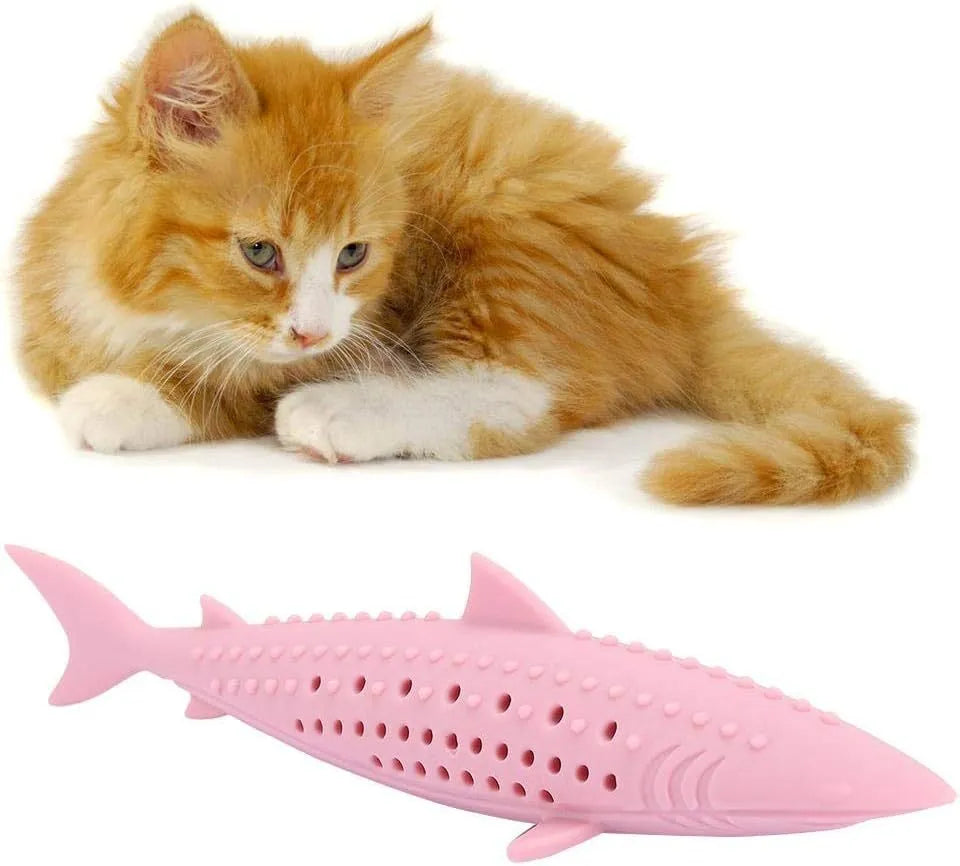 Green fish-shaped silicone cat chew toy with side holes, shown disassembled to reveal hollow interior for catnip.