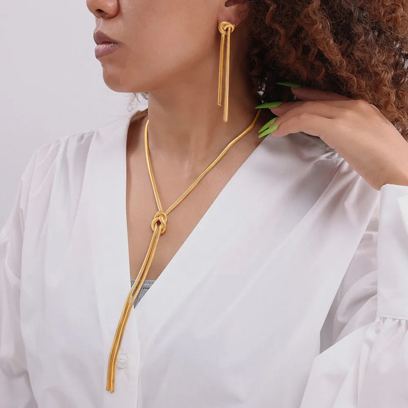Women's gold electroplated titanium steel knotted tassel snake chain long necklace and earring set, a fashion OL style statement piece with regular chain construction for versatile layering.
