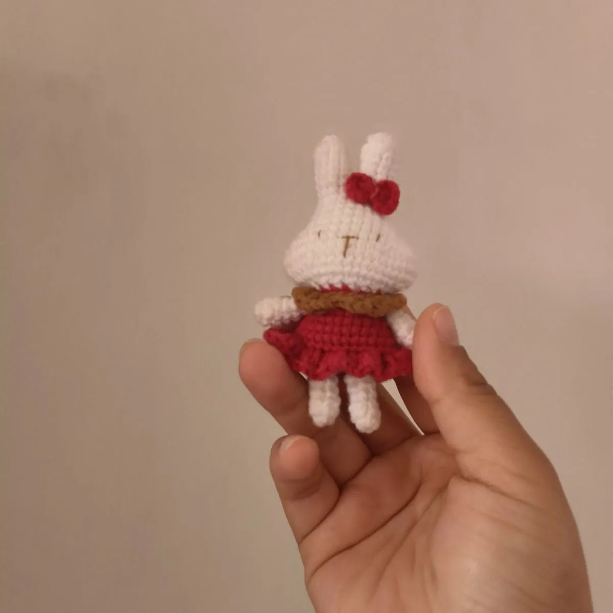Hand-crocheted wool yarn rabbit keychain pendant with decorative design