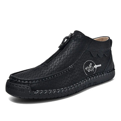 Men's slip-on loafers in black with round toe and sewing thread details, showing rubber sole