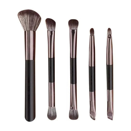 Makeup brush set with mirror compact case showing silver or gold brushes with artificial fibre bristles