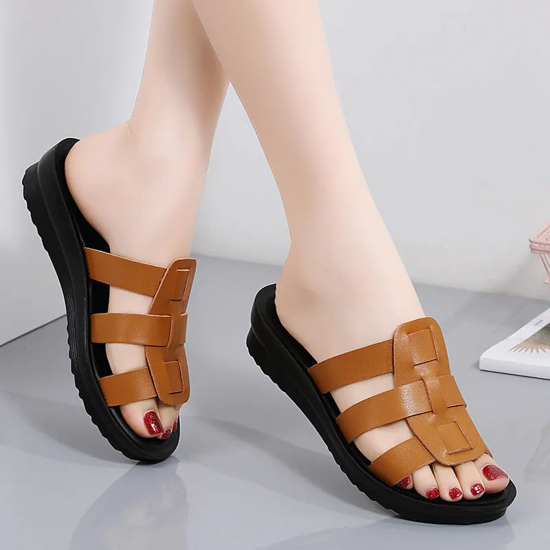 Women's large size flat bottom slippers in beige, black and brown colours with PU leather construction