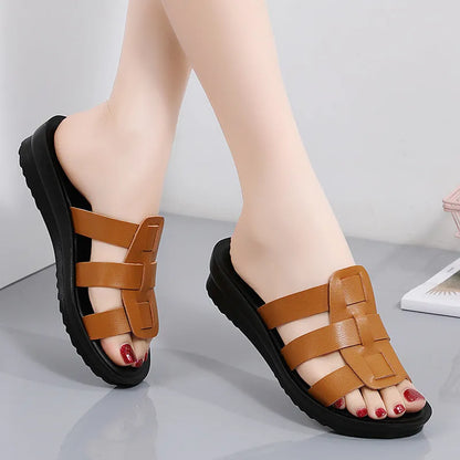 Women's large size flat bottom slippers in beige, black and brown colours with PU leather construction