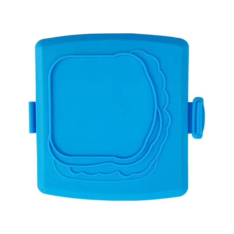 Red silicone baking tray with handbag-shaped mould and matching heat-resistant gloves on kitchen counter