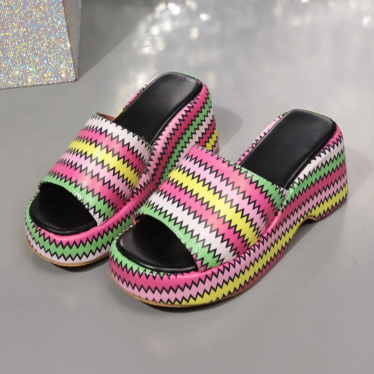 Women's beige wedge sandals with a blue wave print, thick rubber sole, and open fish mouth toe.
