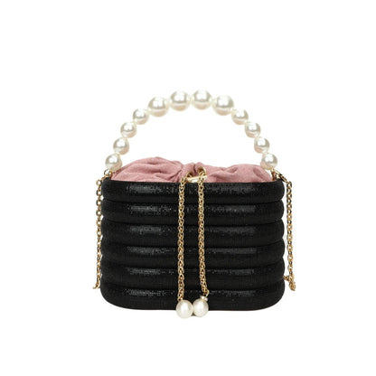 Women's soft PU crossbody bag with beaded accents, round shape, and single shoulder strap in black colour.