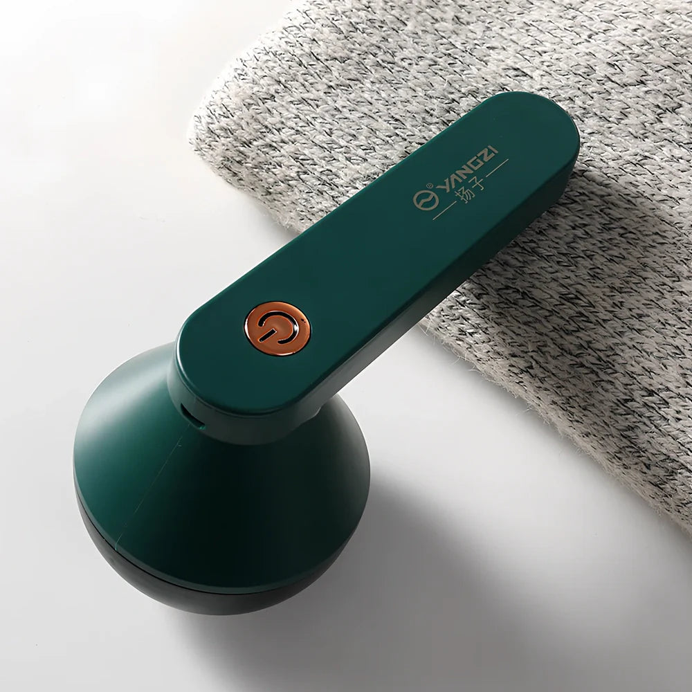 White and green charging shaving machine with straight plug design measuring 13.5cm