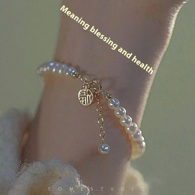 Chinese style glass bead bracelet with bamboo joint design on wrist.
