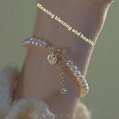 Chinese style glass bead bracelet with bamboo joint design on wrist.
