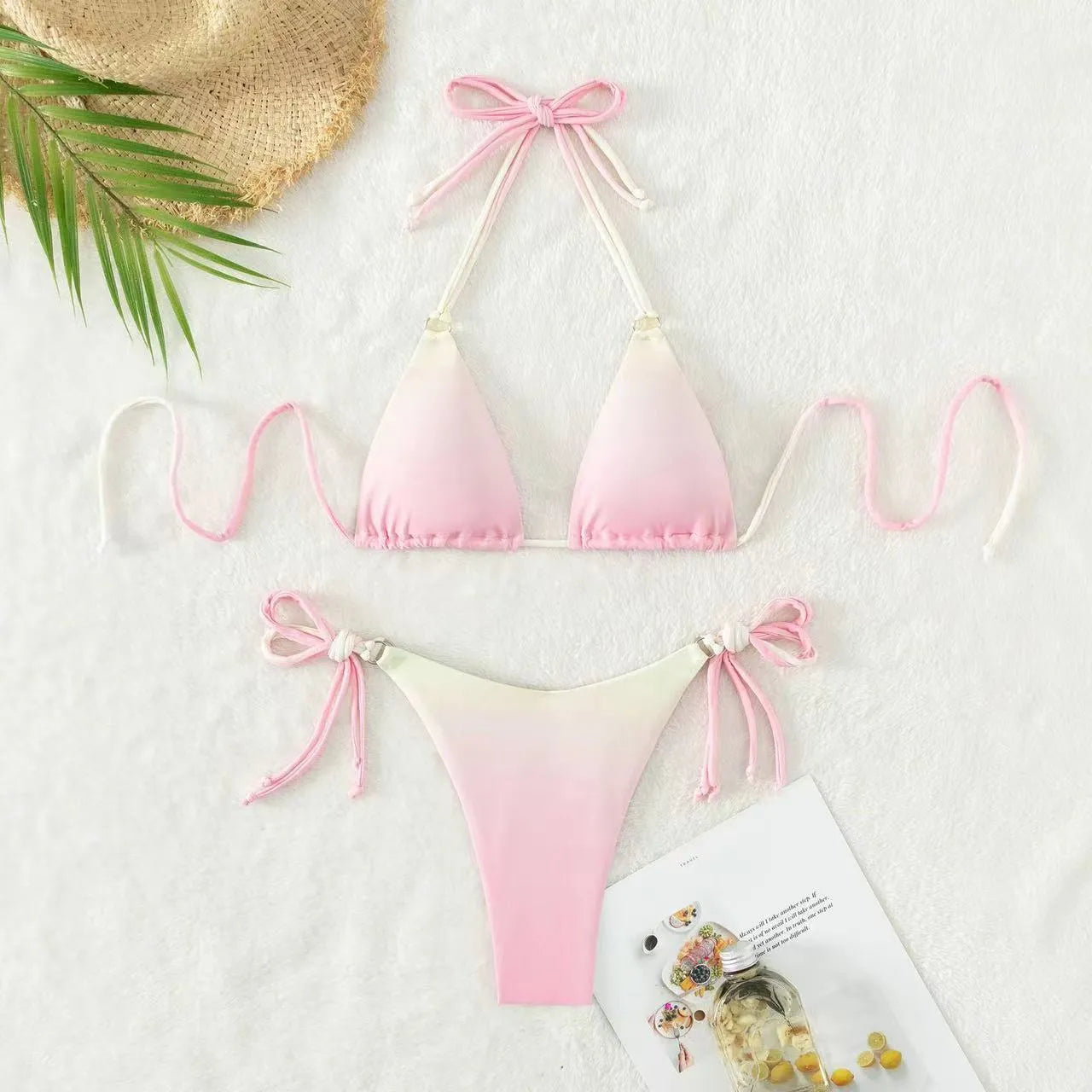Women's two-piece gradient colour bikini swimwear set on a hanger.