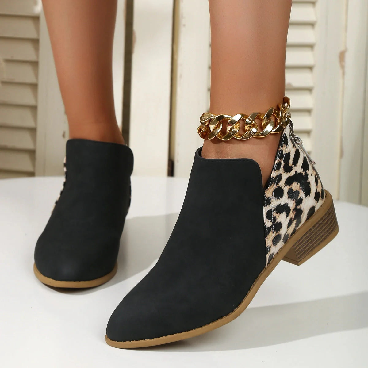 Women's leopard print boots with pointed toe and chunky heel in various colors