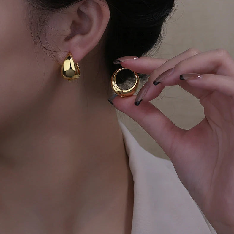 Women's geometric circle earrings with gold inlay treatment and water drop ear clip design