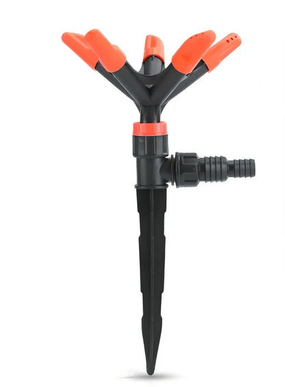Orange automatic rotating garden sprinkler measuring 14cm diameter x 26.5cm height