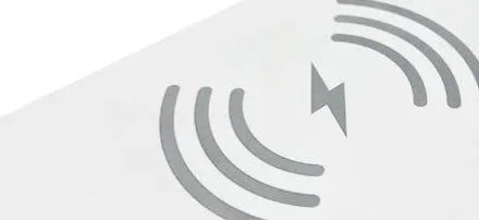 White smart bedside lamp with wireless charging pad, LED lighting, and digital alarm clock display