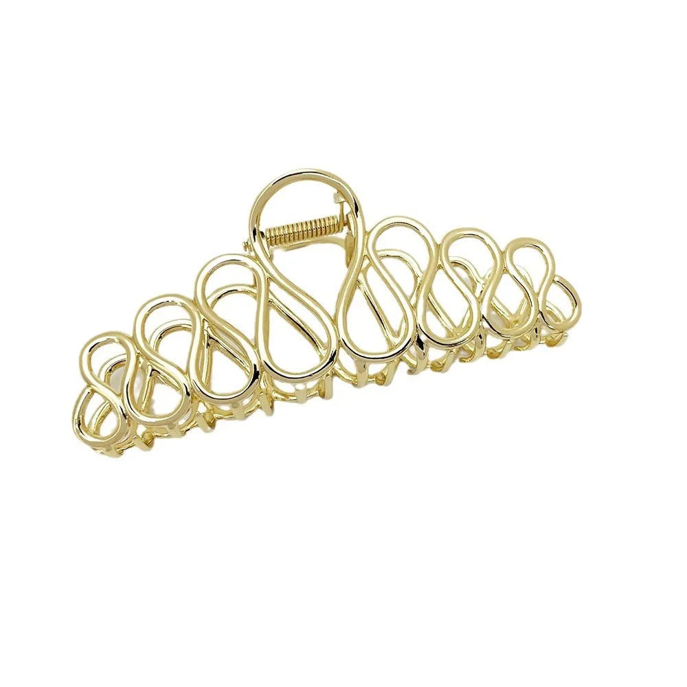 Large gold and silver minimalist hair clip with tassel detail for women's thick hair and updos.
