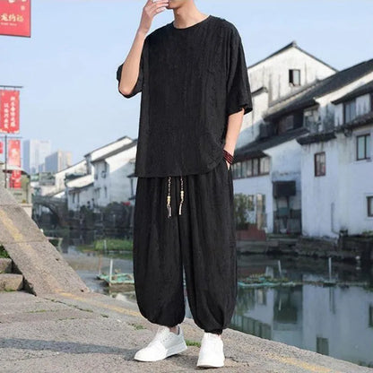 Men's black and grey knitted short-sleeve top with matching loose cropped trousers casual suit set