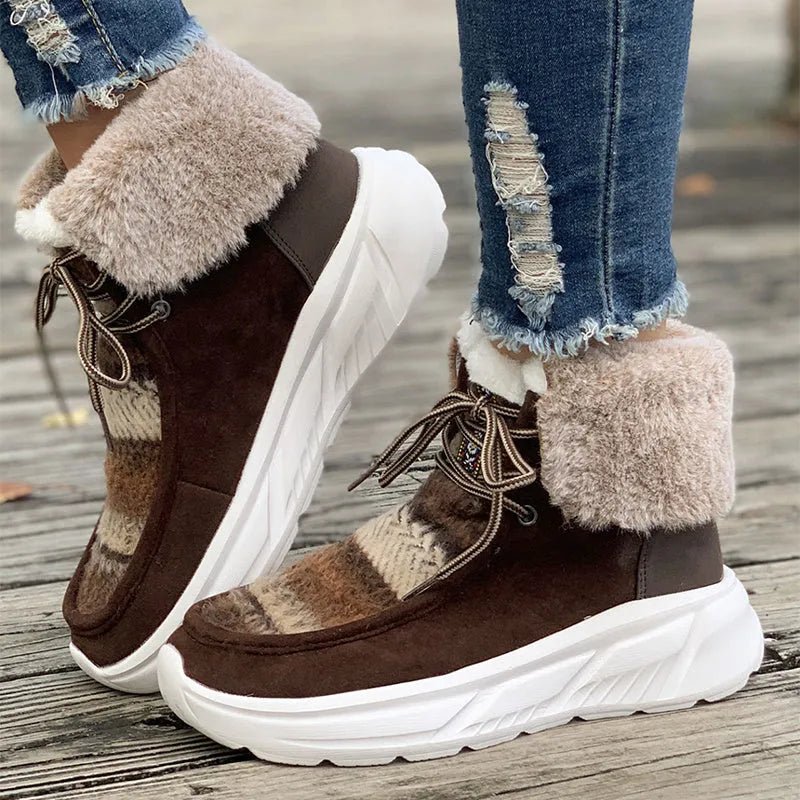Women's lace-up snow boots in beige with suede upper, thermal fur lining, and non-slip rubber sole on a winter background