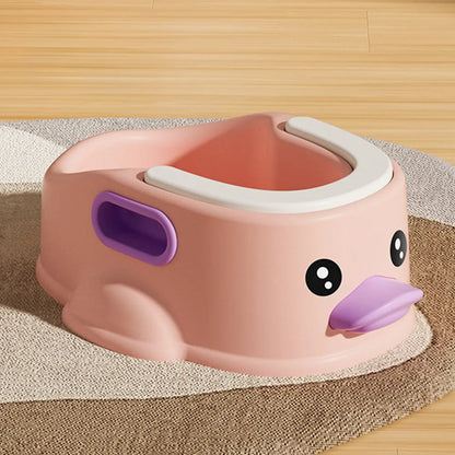Blue PVC duck-shaped bathtub for washing a small dog or cat outdoors.