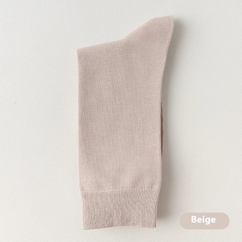 Mid-calf business socks in solid colours with combed cotton construction and deodorant function