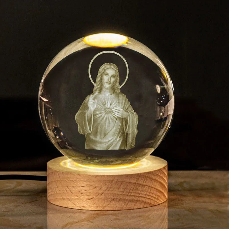 White crystal ball ornament with solid wood warm light base, showing purity engravings like Cross and Maria for desk decor