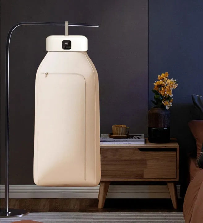 White cylindrical compact laundry dryer with remote control, dimensions 29x22x10cm, foldable for storage