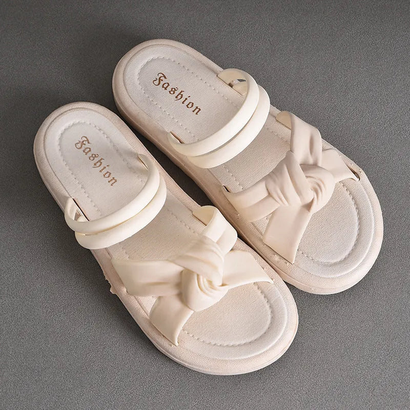 Women's sandals with thick soft back and two-way wear design, solid colour PVC construction with injection moulded sole, black or white slip-on style suitable for outdoor and leisure use, available in sizes 36 to 41
