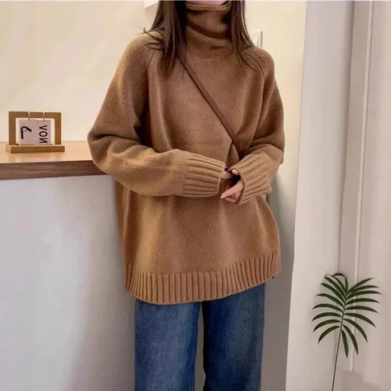 Women's turtleneck sweater in loose fit with thick curling pile collar, available in red, camel, grey, and black colours