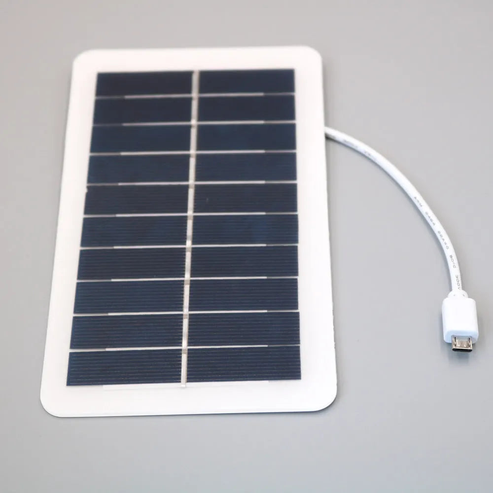 Black solar panel mobile phone charger with USB port showing compact portable design