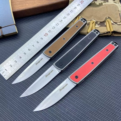 Folding fruit knife with 7cm stainless steel blade shown open and closed, available in black, red, or coffee colour finishes