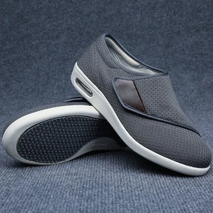 Beige leisure shoes for elderly with Velcro strap and rubber foam sole.