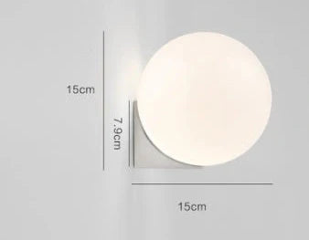 Nordic minimalist wall lamp with adjustable double heads in black finish mounted on white wall