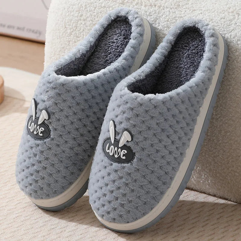 Women's plush rabbit plaid design winter slippers with a thick light-coloured rubber sole.
