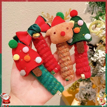 Festive Christmas hair ties with various holiday-themed designs, including red bells, green Christmas trees, and khaki deer shapes.