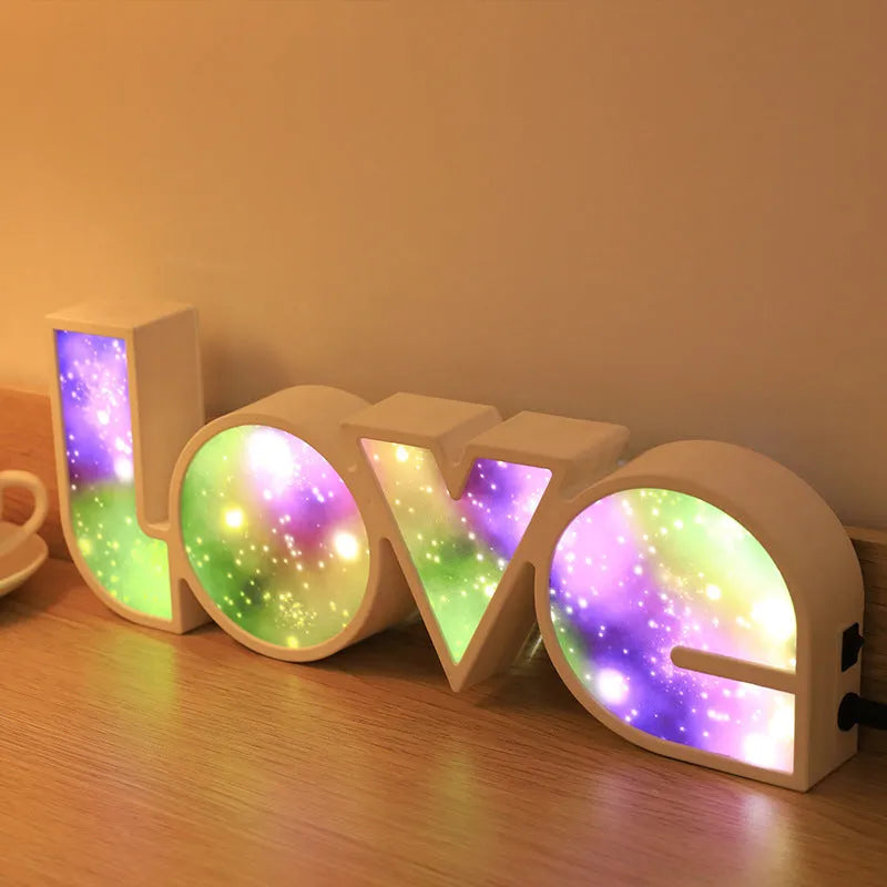 Rainbow halo LED love light with 'LOVE' word decoration on plastic casing.
