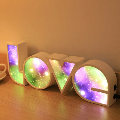 Rainbow halo LED love light with 'LOVE' word decoration on plastic casing.